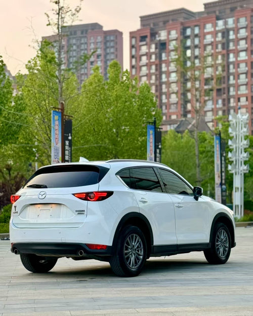 # 标准英文翻译 **2021 Mazda CX-5 2.5L Two-Wheel Drive Premium Edition (Automatic Transmission)**  ### 汽车行业精简通用版（外贸/海报常用） **2021 Mazda CX-5 2.5L FWD Supreme AT** - FWD = 前置前驱（两驱） - AT = 自动挡 - Supreme = 智尊型